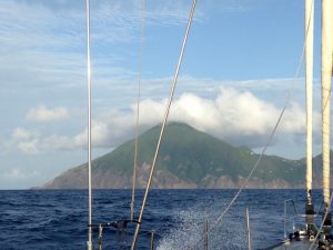 Saba on the bow as we sail on Pacific Wave towards the Caribbean island