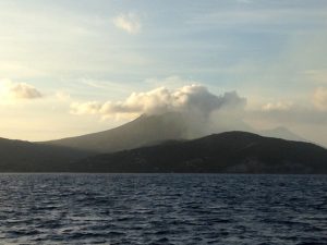 Sailing past Montserrat on Pacific Wave with a strong smell of sulphur from the volcano