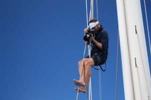 Jeff Bark photographer for Louis Vuitton up the rigging of SY Pacific Wave