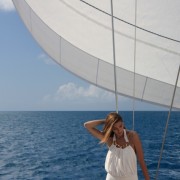 Bikini model posses beneath the sail Bikini model posses beneath the sail
